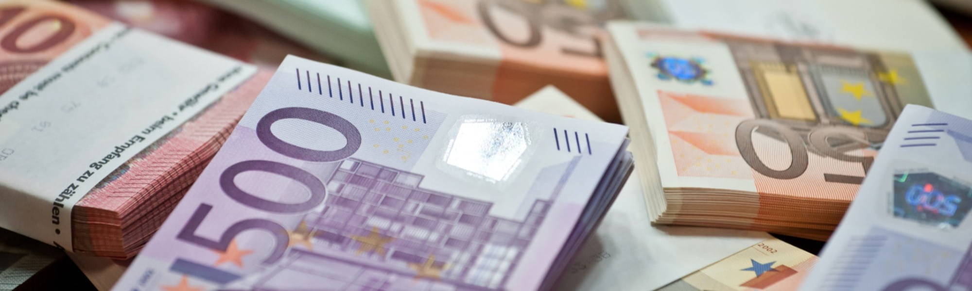 euro notes stacked, typical salaries wages in Ireland Europe